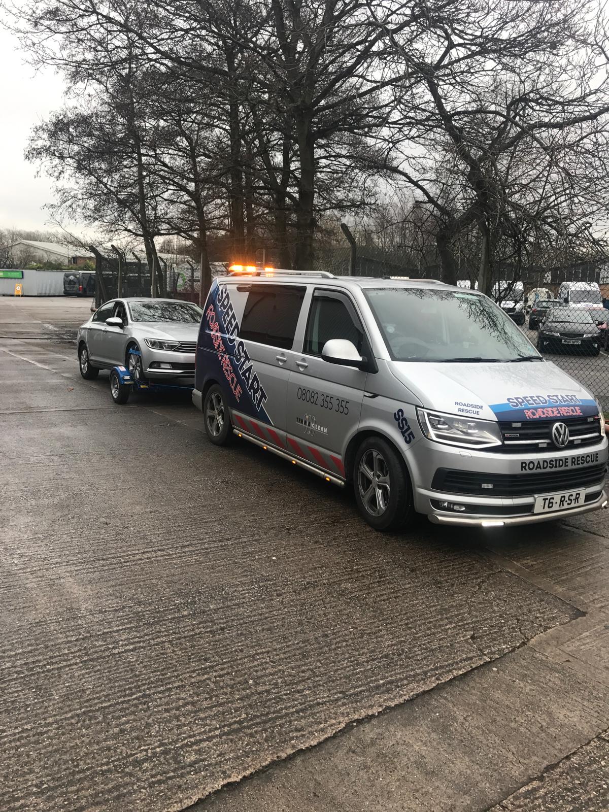 Breakdown recovery vehicle assisting a customer